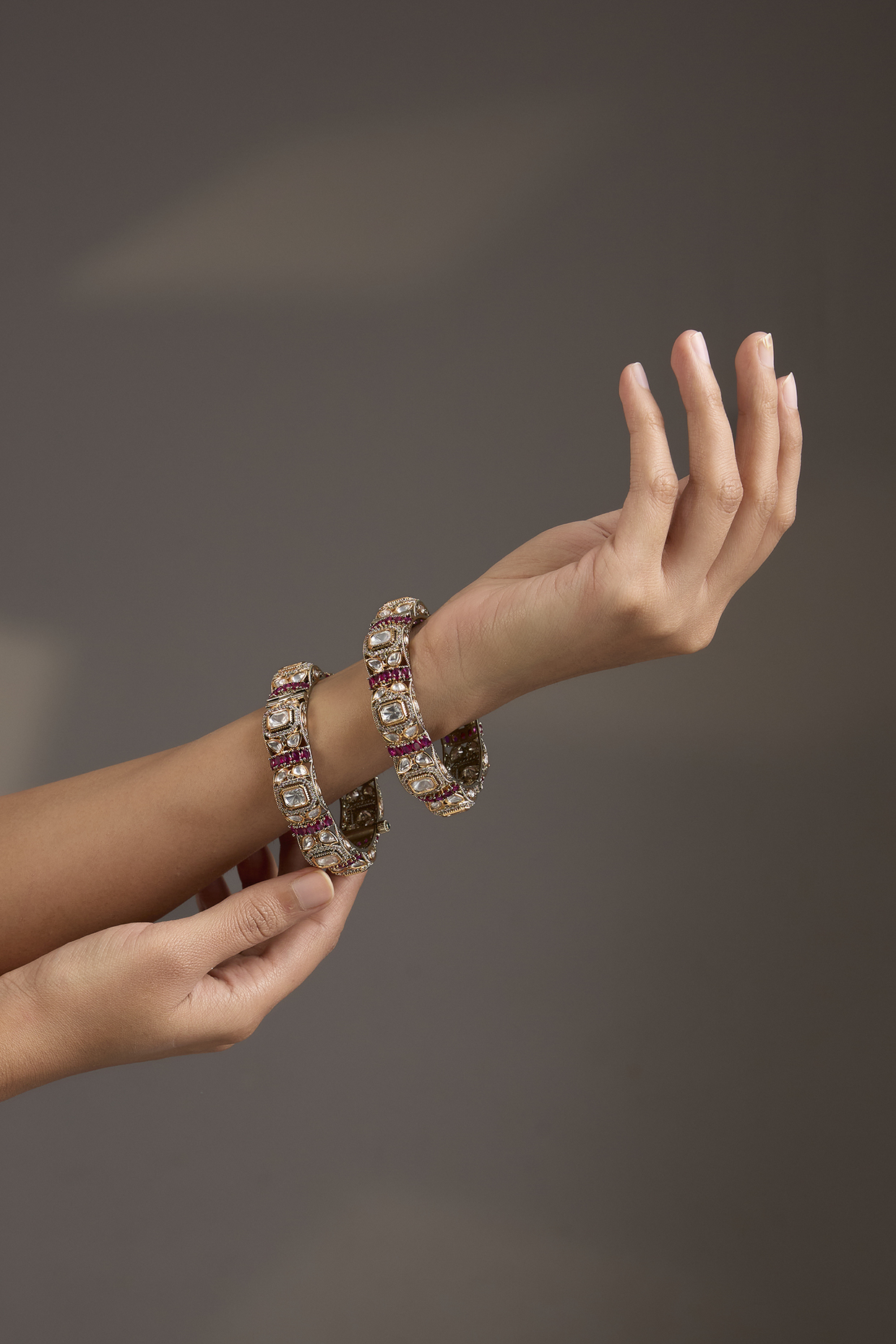 Antique Gold Finish Kundan Polki & Ruby Pink Stone Bangles (Set Of 2) by Aura Trends