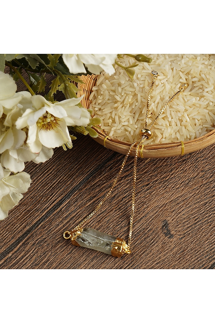 Gold Finish Bracelet Rakhi With Semi-Precious Agate Stone by Auraa Trends at Pernia's Pop Up Shop