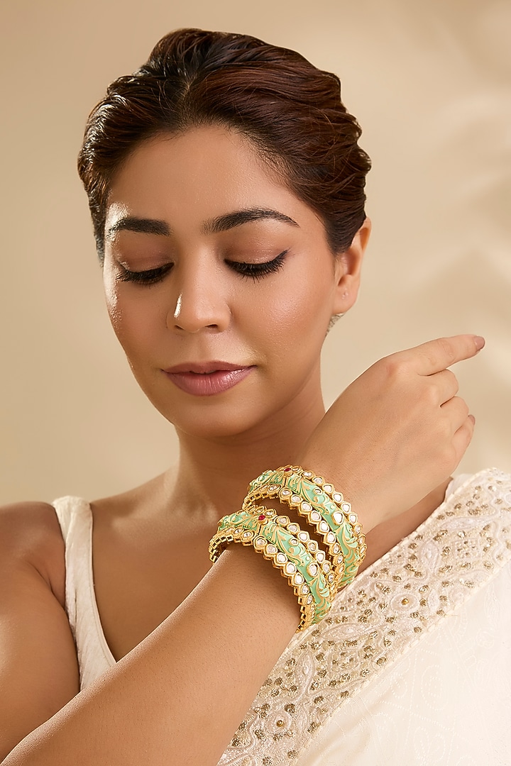 Antique Gold Finish Kundan Polki & Ruby Stone Bangles (Set Of 2) by Aura Trends at Pernia's Pop Up Shop