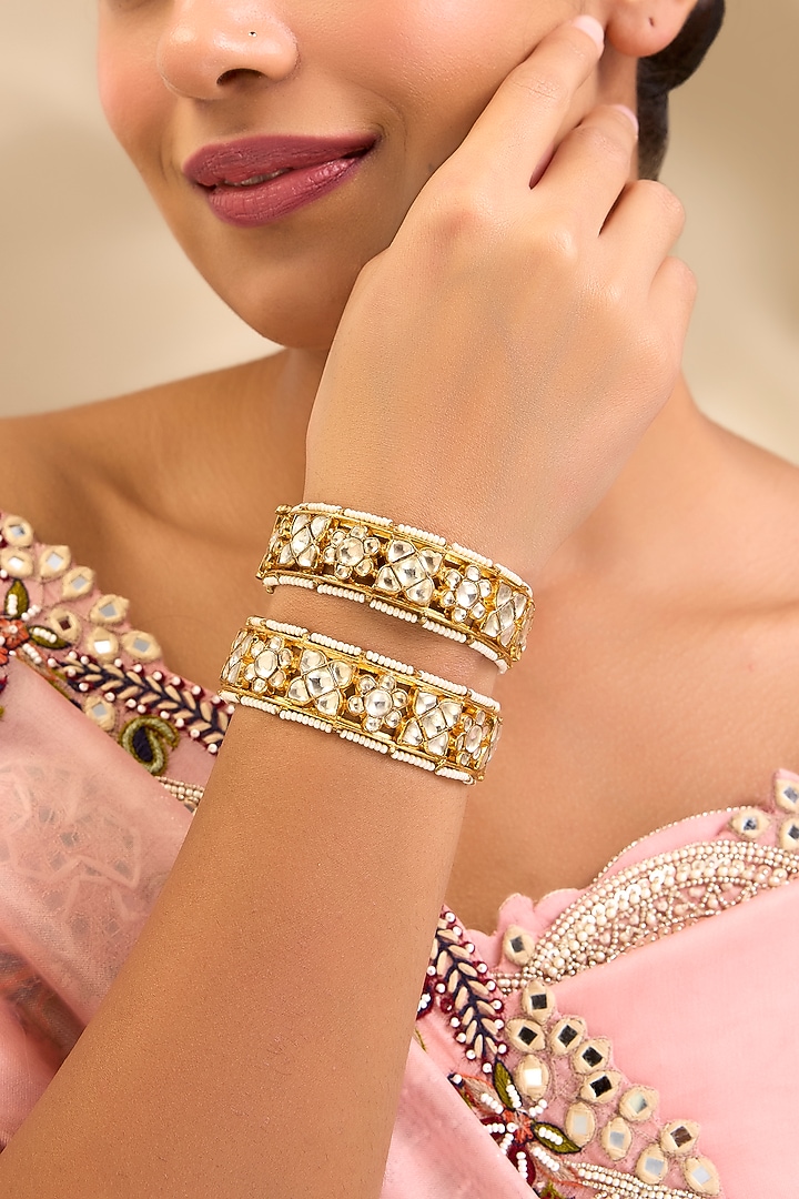 Gold Finish Kundan Polki Floral Motifs Bangles (Set Of 2) by Aura Trends at Pernia's Pop Up Shop