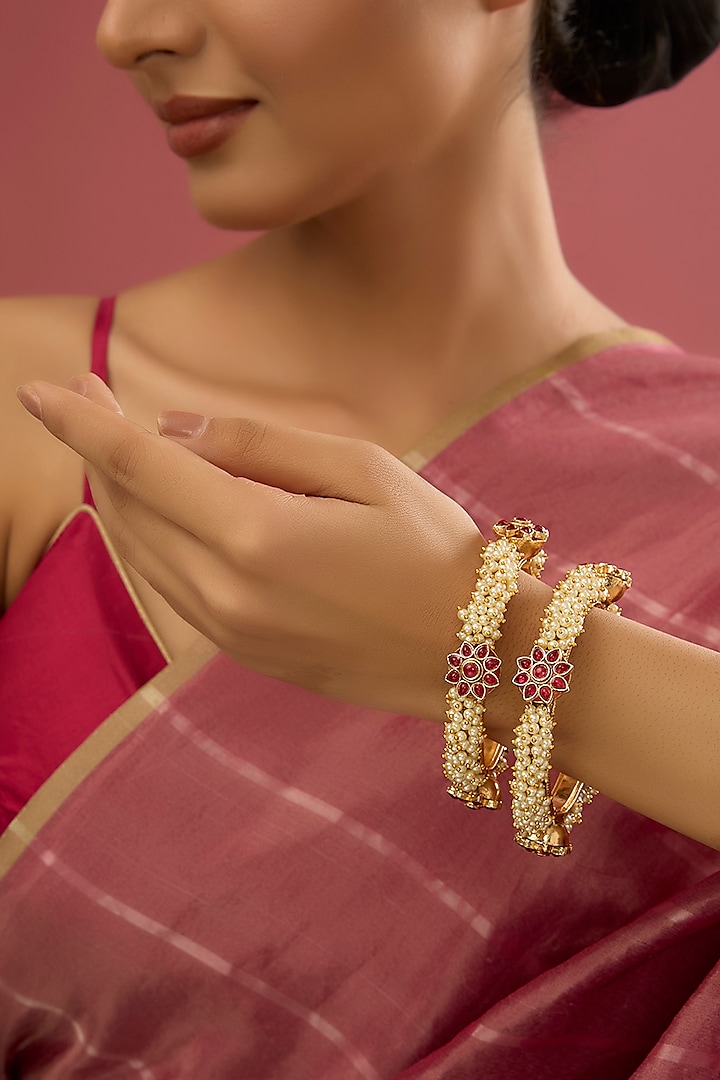 Rose Gold Finish Kundan Polki & Pearl Bangles (Set Of 2) by Auraa Trends at Pernia's Pop Up Shop