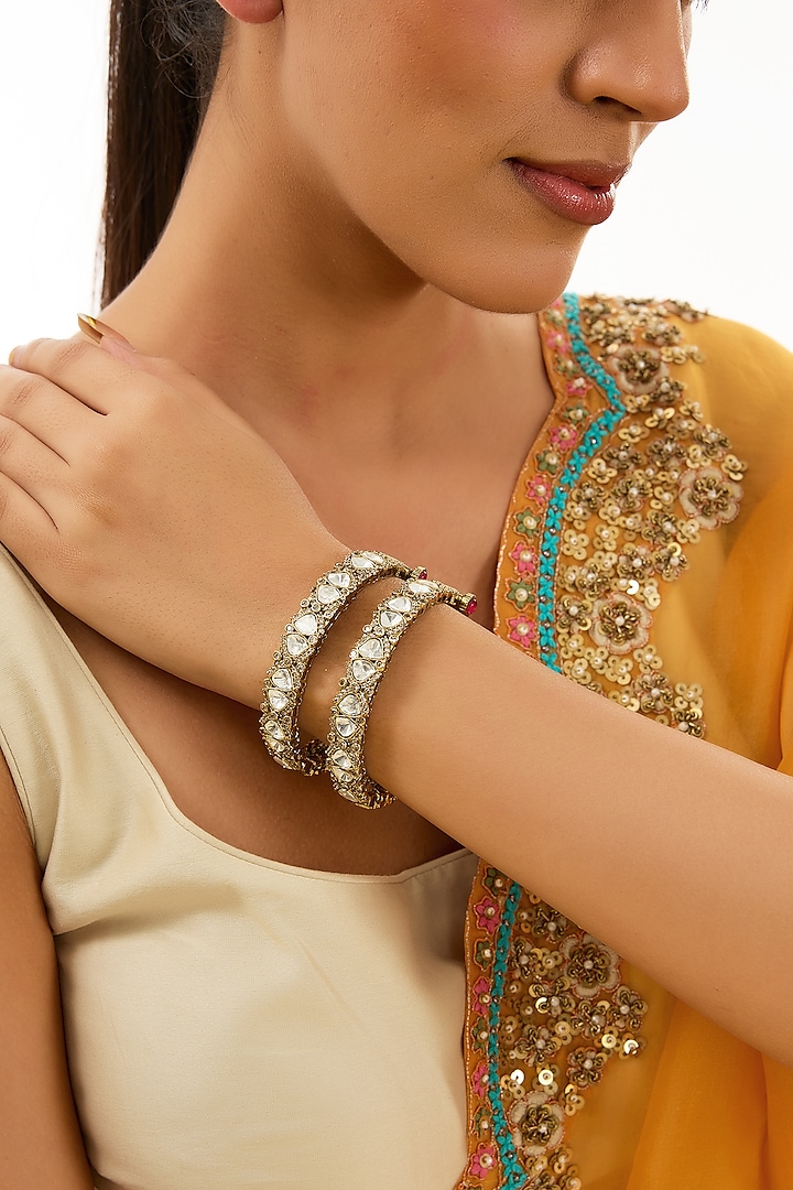 Gold Finish Kundan Polki & Beaded Enameled Bangles (Set of 2) by Auraa Trends at Pernia's Pop Up Shop