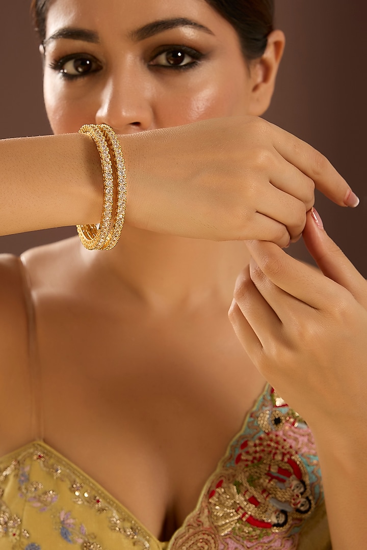 Gold Finish Kundan Polki & Pearl Bangles (Set Of 2) by Auraa Trends at Pernia's Pop Up Shop