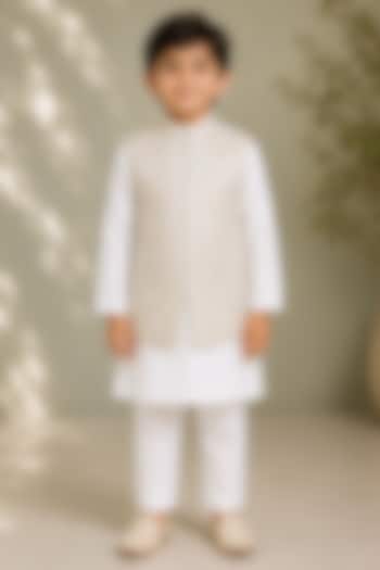 Beige Silk Embroidered Bundi Jacket For Boys by Arun Verma Kids at Pernia's Pop Up Shop