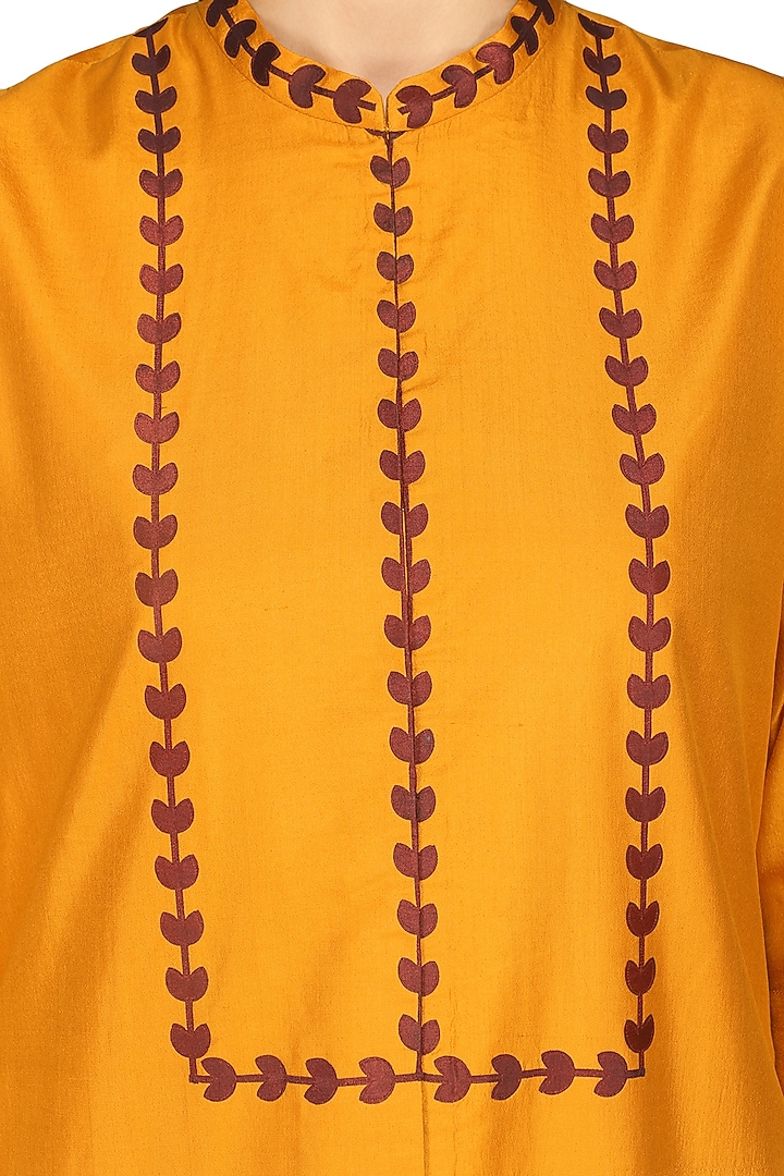 Orange laser cut embroidered tunic with pants available only at Pernia's Pop Up Shop.