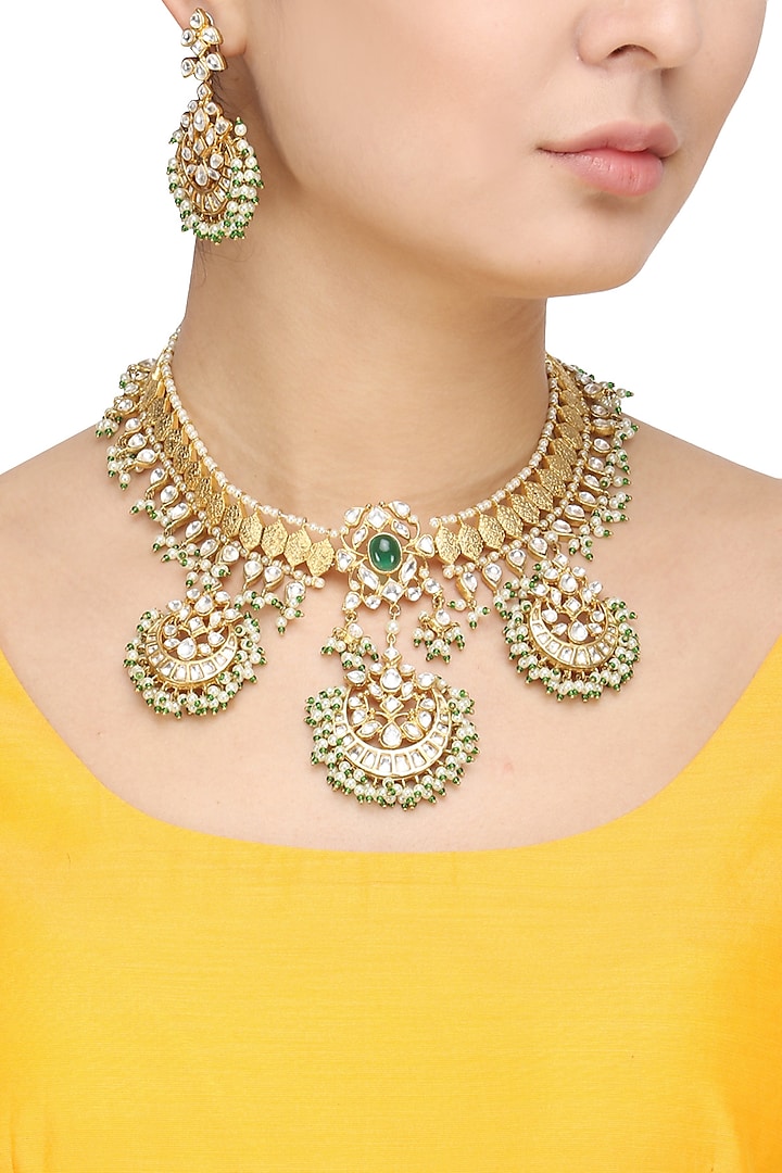 Gold Finish Kundan Stone Crescent Motifs Necklace Set by Auraa Trends