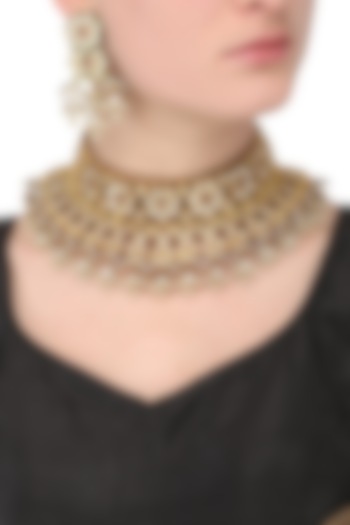 Gold finish kundan and red stone flower motif choker necklace set available only at Pernia's Pop Up Shop.