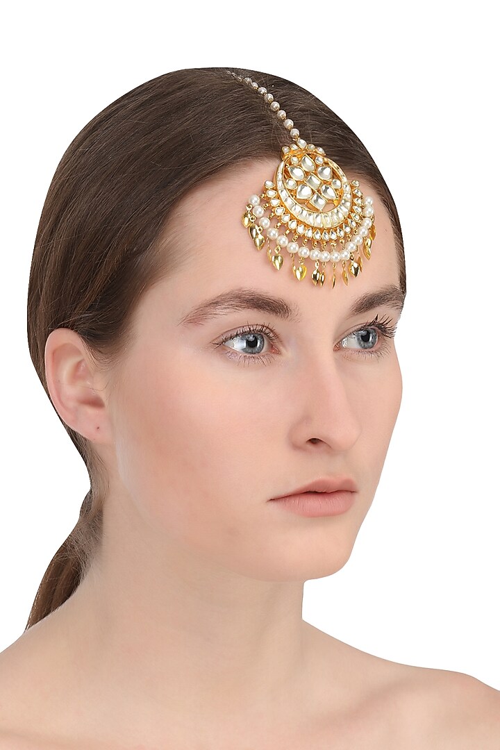 Gold finish Kundan and Green stone crescent Maangtika available only at Pernia's Pop Up Shop.