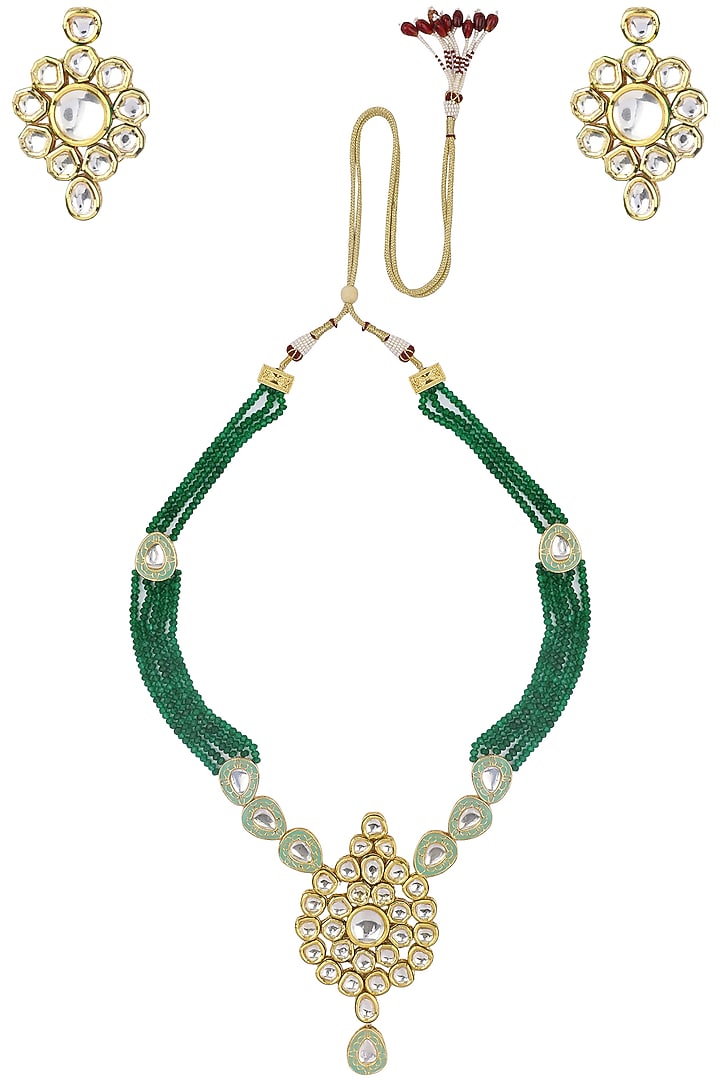 Gold finish kundan and green semi precious stone necklace set available only at Pernia's Pop Up Shop.