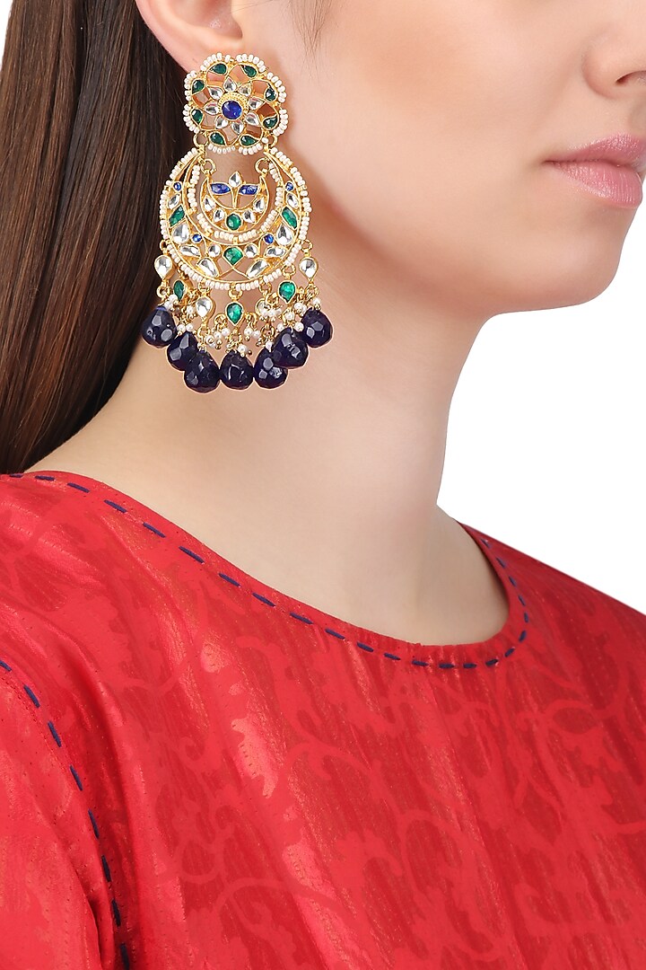 Gold finish kundan and blue semi precious stone earrings available only at Pernia's Pop Up Shop.
