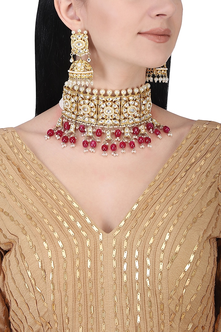 Gold plated kundan and red beads choker necklace set by AURAA TRENDS