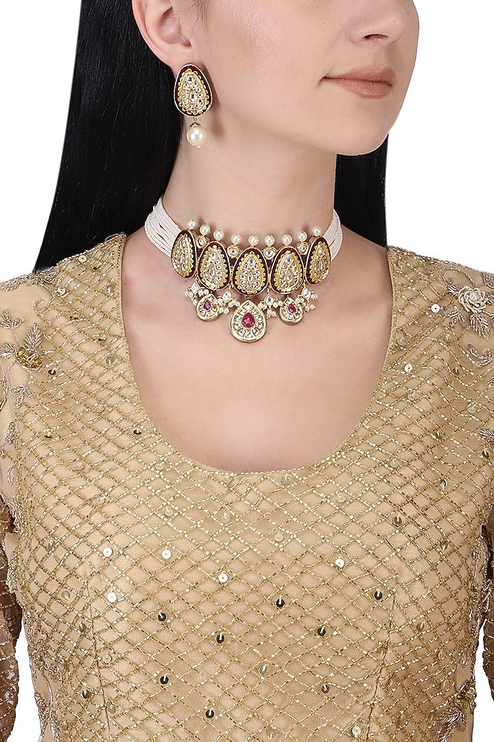 Gold plated kundan, red stones and pearls choker necklace set by AURAA TRENDS