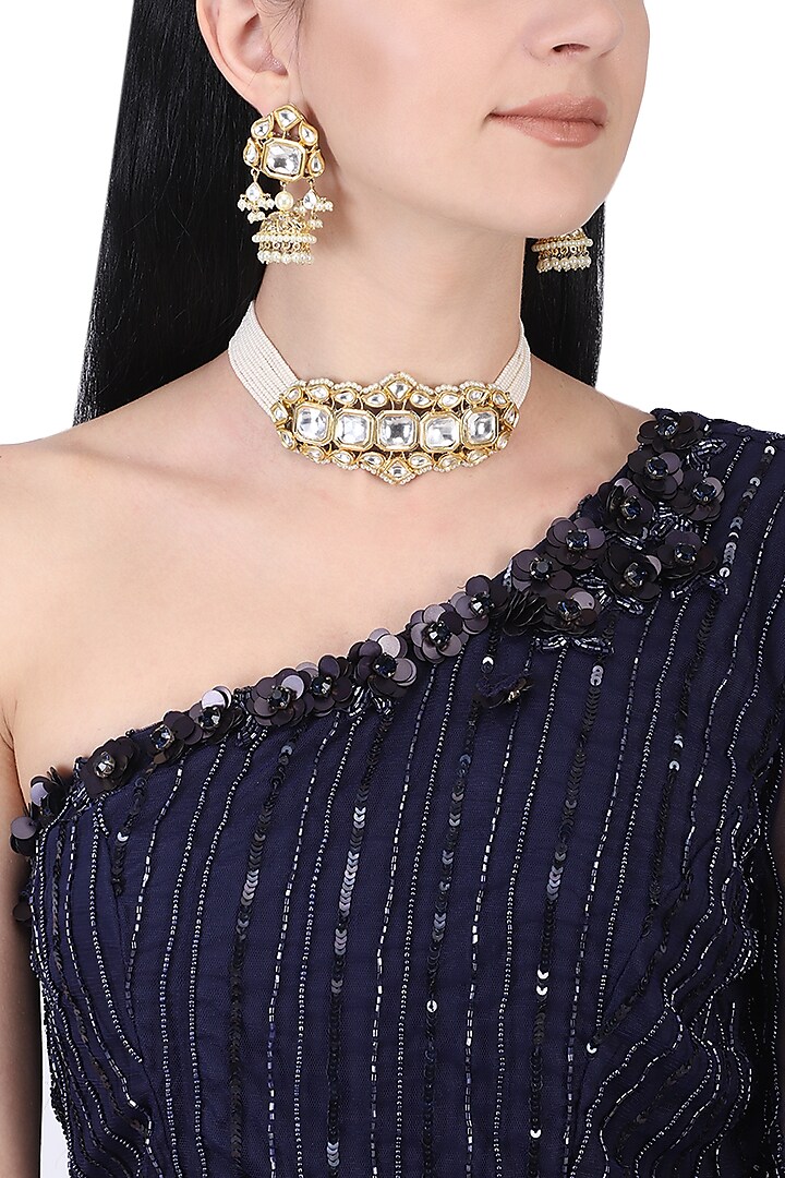 Gold plated white kundan and pearl choker necklace set by AURAA TRENDS