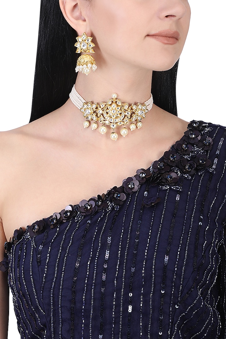 Gold plated kundan and white pearl choker necklace set by AURAA TRENDS