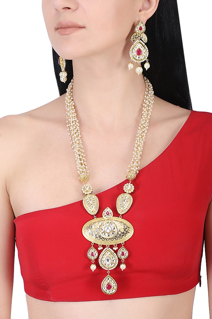 Gold plated kundan and red stone long necklace set by AURAA TRENDS