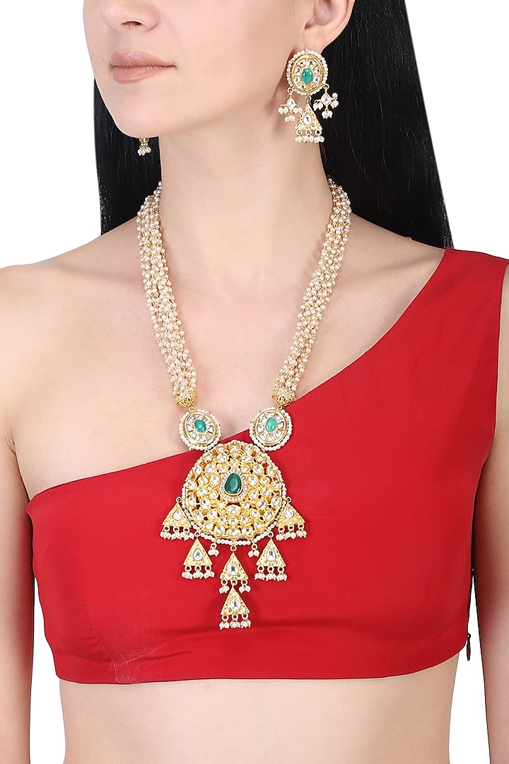 Gold plated kundan and green stone long necklace set by AURAA TRENDS