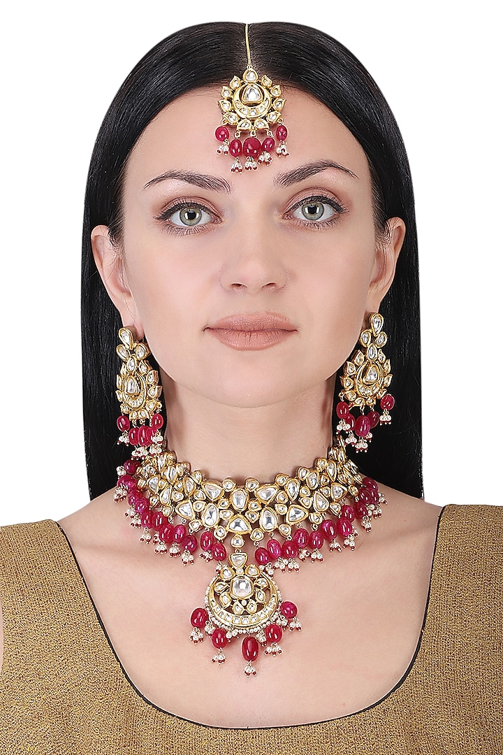 Gold plated kundan and red beads necklace set by AURAA TRENDS