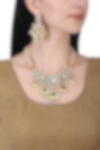 Gold plated kundan, green beads and pearl necklace set by AURAA TRENDS