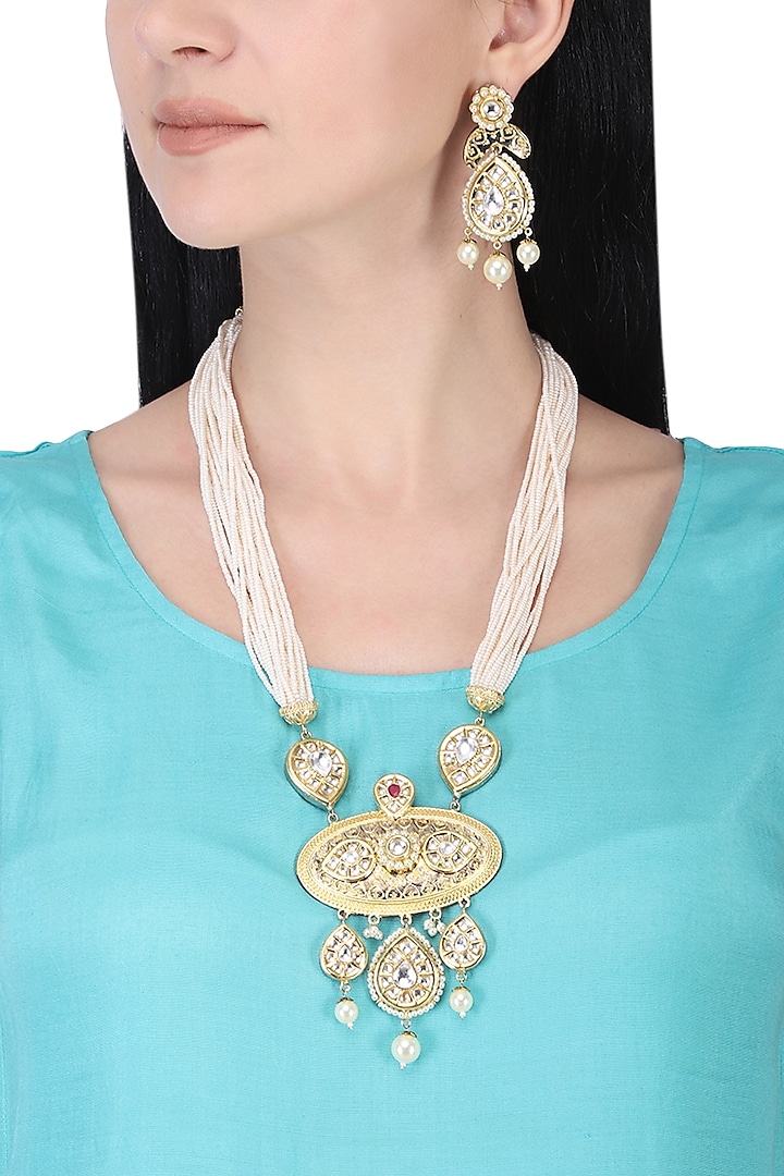 Gold plated white kundan and pearl drop long necklace set by AURAA TRENDS