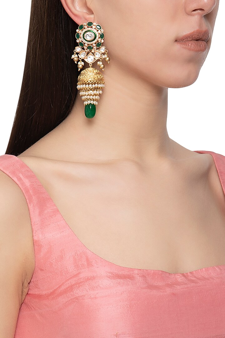 Gold plated kundan and green stone jhumki earrings by Auraa Trends