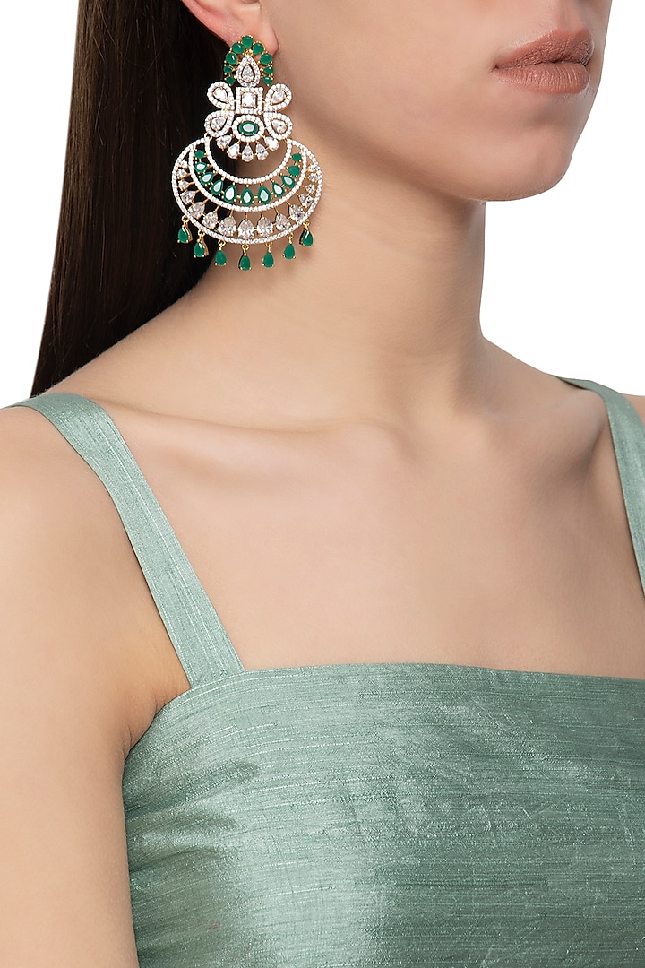 Gold plated diamond and green stone dangler earrings by Auraa Trends
