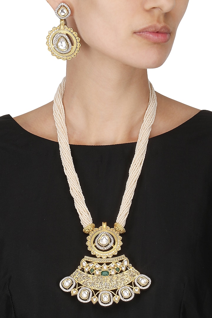 Antique gold finish kundan studded pendant set available only at Pernia's Pop Up Shop.