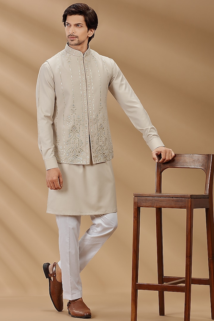 Beige Embroidered Bundi Jacket With Kurta Set by AVEGA