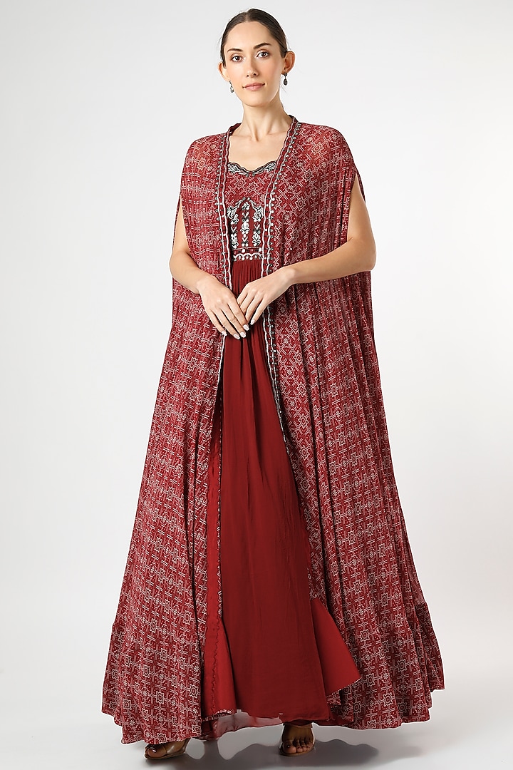 Dusky Red Embroidered Gown With Cape by AWIGNA BY VARSHA & RITTU