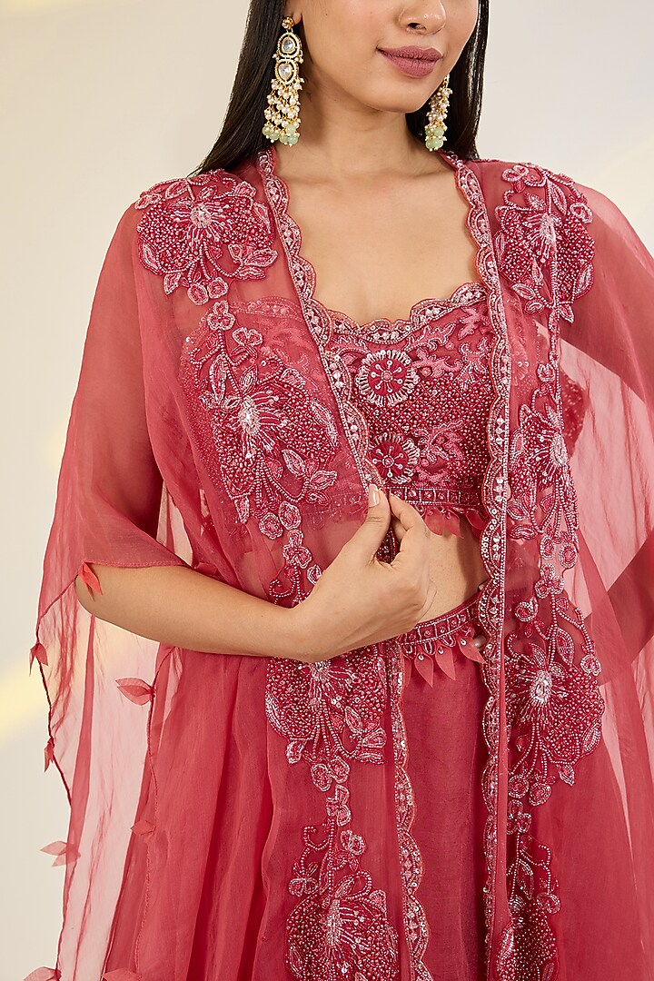 Coral Red Organza & Net Floral Embroidered Jacket Wedding Lehenga Set by AWIGNA BY VARSHA & RITTU at Pernia's Pop Up Shop