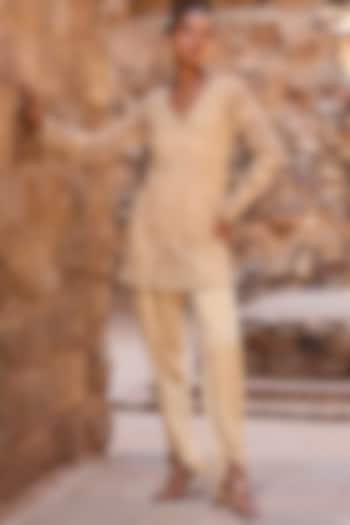 Champagne Net Metal Beads Embroidered Short Kurta Set by AWIGNA BY VARSHA & RITTU at Pernia's Pop Up Shop