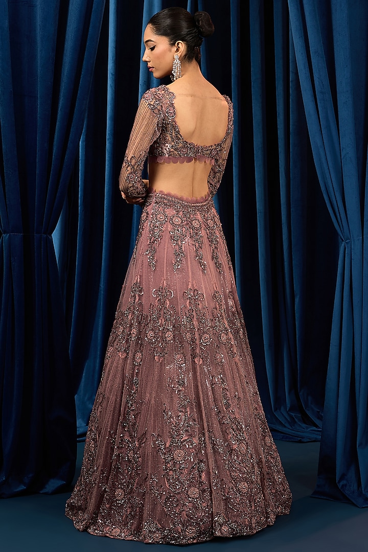 Dusty Onion Pink Net Floral Motifs Embroidered Wedding Lehenga Set by AWIGNA BY VARSHA & RITTU at Pernia's Pop Up Shop
