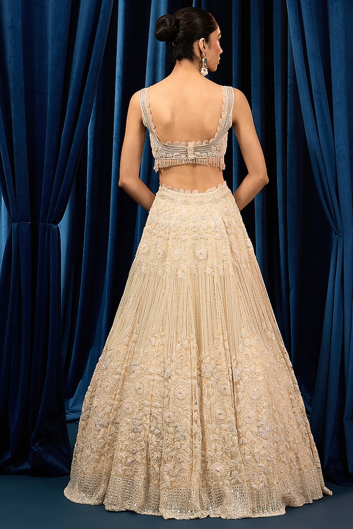 Ivory Net Floral Embroidered Bridal Lehenga Set by AWIGNA BY VARSHA & RITTU at Pernia's Pop Up Shop