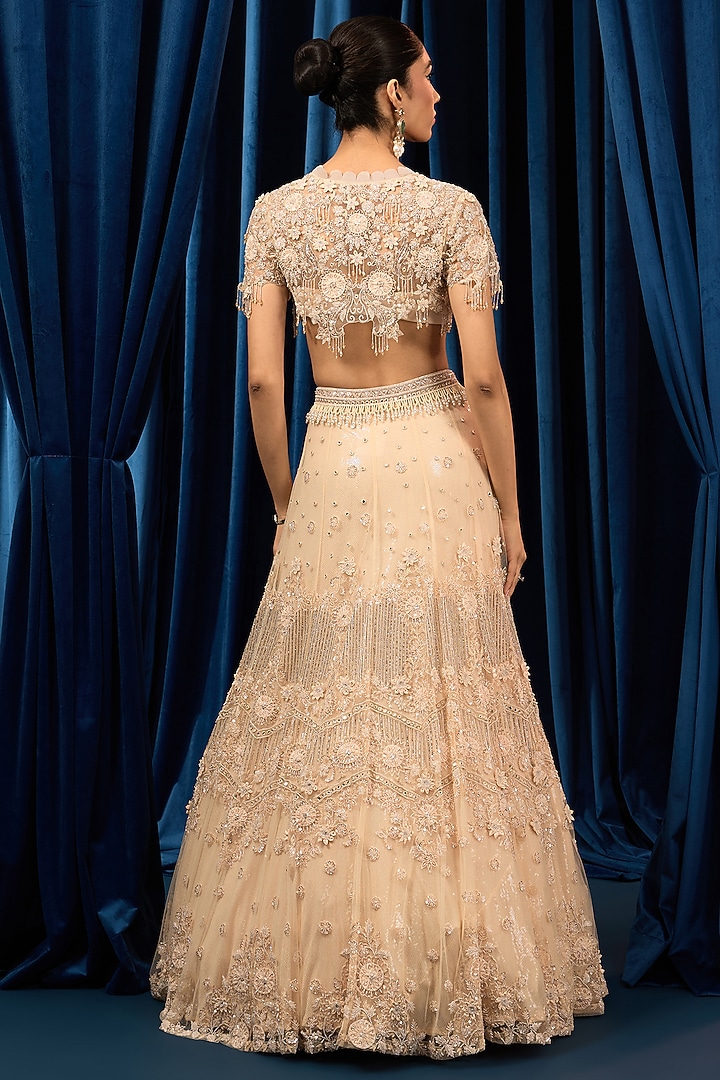Ivory Net Floral & Crystal Embroidered Wedding Lehenga Set by AWIGNA BY VARSHA & RITTU at Pernia's Pop Up Shop