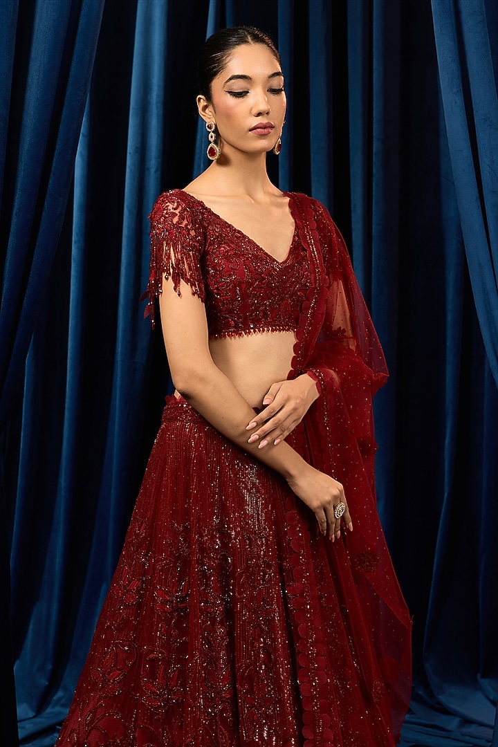 Red Net 3D Floral Embroidered Bridal Lehenga Set by AWIGNA BY VARSHA & RITTU at Pernia's Pop Up Shop