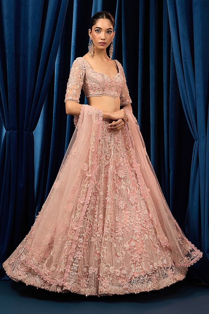 Rose Pink Net 3D Floral Embroidered Bridal Lehenga Set by AWIGNA BY VARSHA & RITTU at Pernia's Pop Up Shop