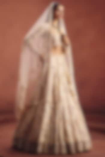 Ivory Net Embroidered Bridal Lehenga Set by AWIGNA BY VARSHA & RITTU at Pernia's Pop Up Shop