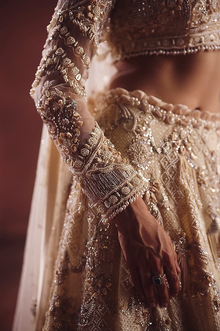 Ivory Net Embroidered Bridal Lehenga Set by AWIGNA BY VARSHA & RITTU at Pernia's Pop Up Shop