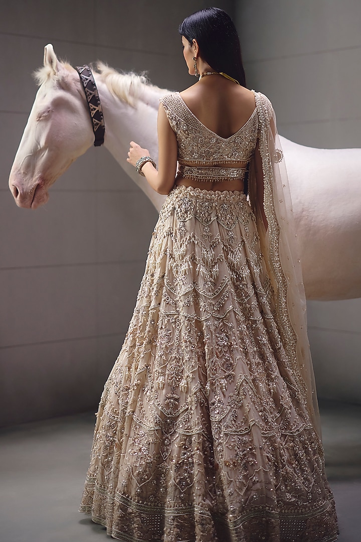 Ivory Sequins Embroidered Bridal Lehenga Set by AWIGNA BY VARSHA & RITTU at Pernia's Pop Up Shop