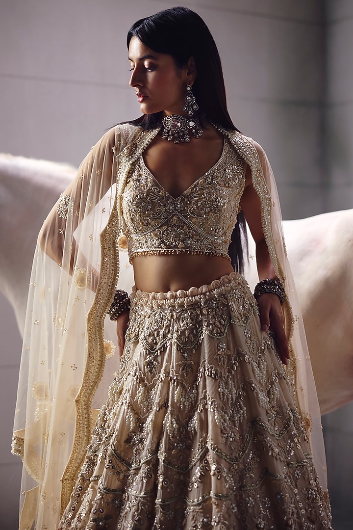 Ivory Sequins Embroidered Bridal Lehenga Set by AWIGNA BY VARSHA & RITTU at Pernia's Pop Up Shop
