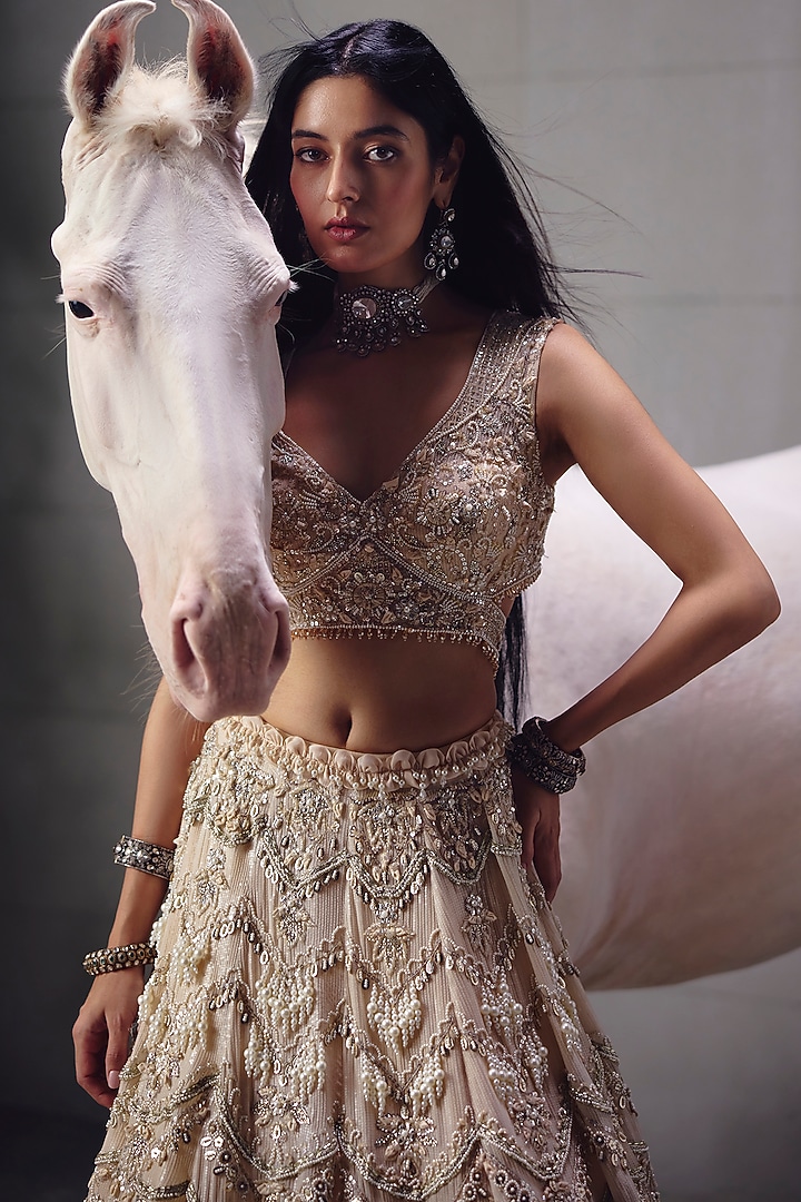 Ivory Sequins Embroidered Bridal Lehenga Set by AWIGNA BY VARSHA & RITTU at Pernia's Pop Up Shop