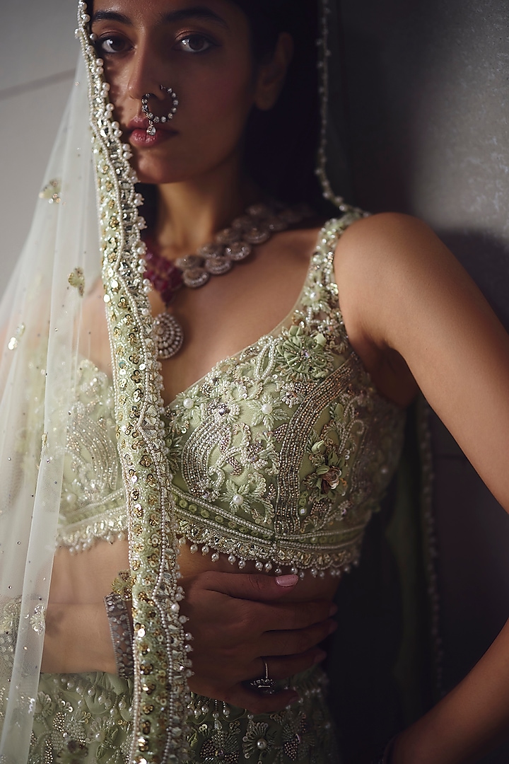Sage Green Net Embroidered Bridal Lehenga Set by AWIGNA BY VARSHA & RITTU at Pernia's Pop Up Shop