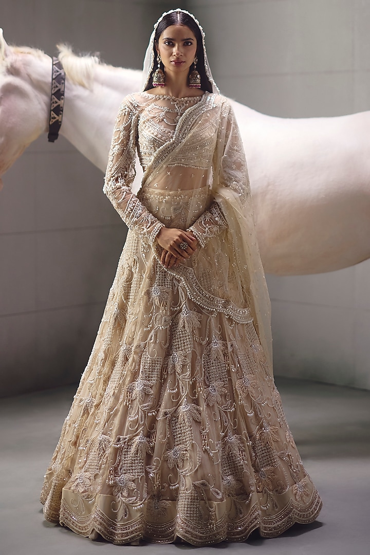 Ivory Sequins Embroidered Bridal Lehenga Set by AWIGNA BY VARSHA & RITTU at Pernia's Pop Up Shop