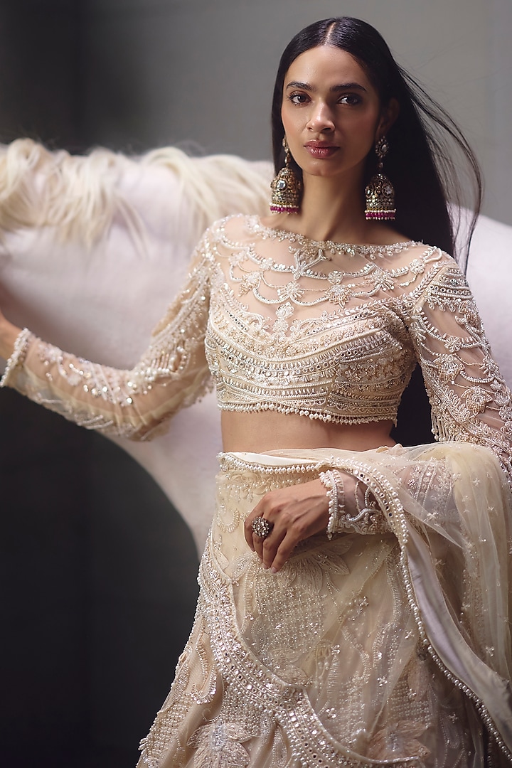 Ivory Sequins Embroidered Bridal Lehenga Set by AWIGNA BY VARSHA & RITTU at Pernia's Pop Up Shop