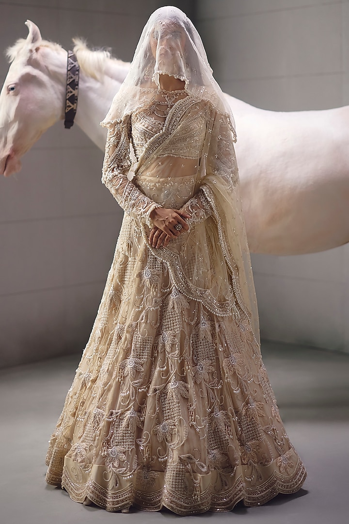 Ivory Sequins Embroidered Bridal Lehenga Set by AWIGNA BY VARSHA & RITTU at Pernia's Pop Up Shop