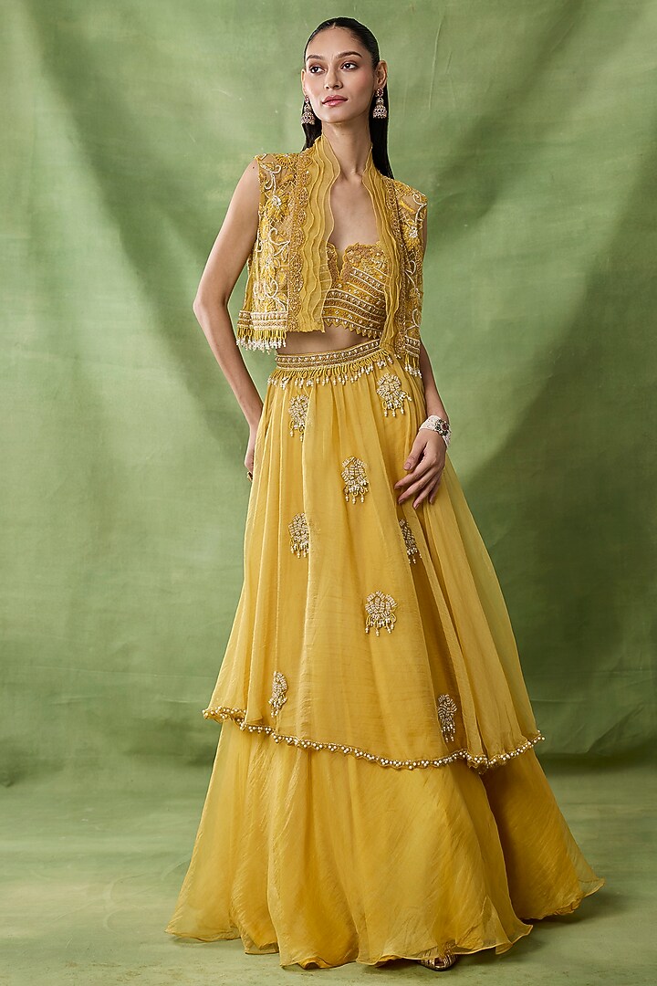 Yellow Organza Net Ruffled Layered Skirt Set by AWIGNA BY VARSHA & RITTU at Pernia's Pop Up Shop