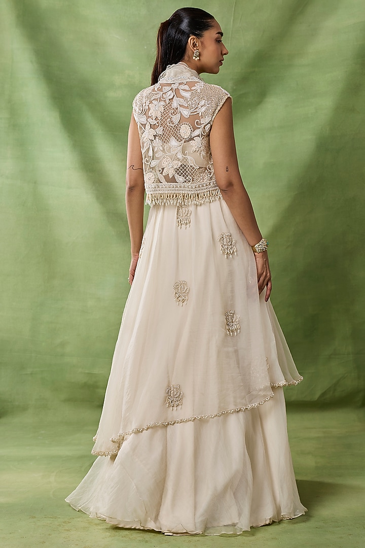 Ivory Organza Net Ruffled Layered Skirt Set by AWIGNA BY VARSHA & RITTU at Pernia's Pop Up Shop