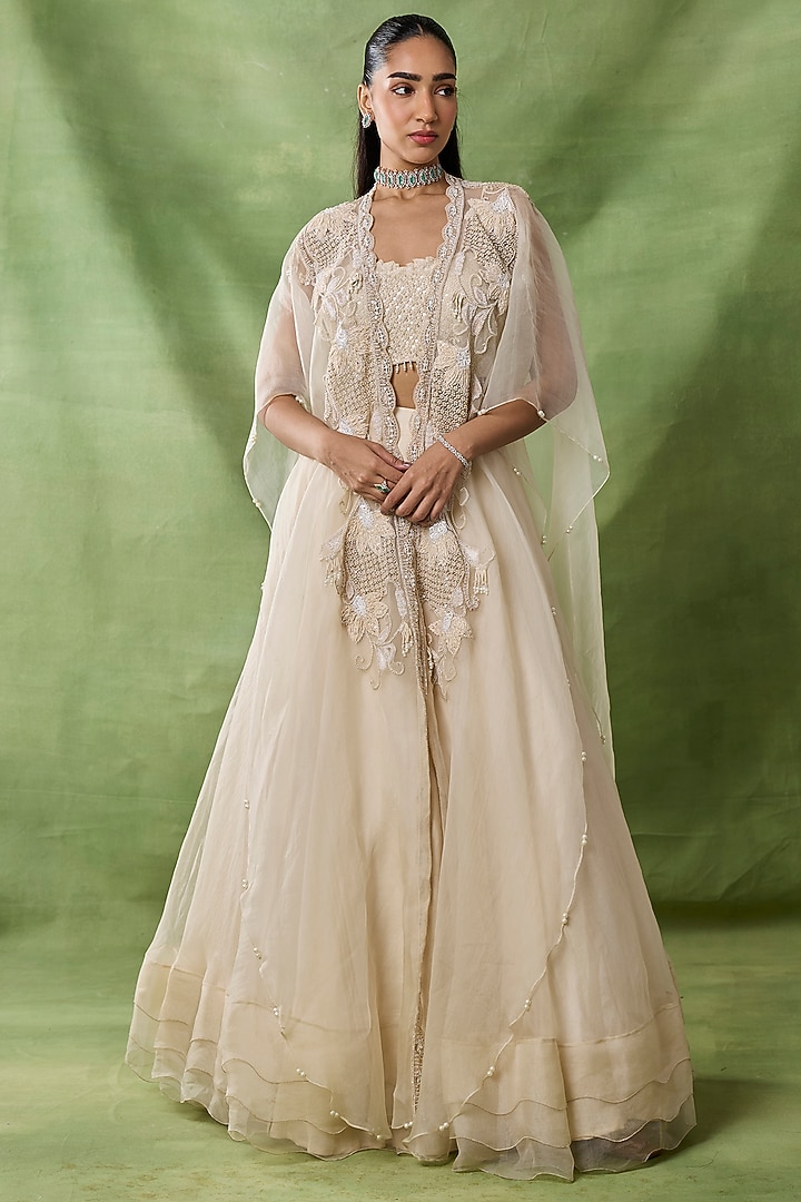 Ivory Organza Net Flared Skirt Set by AWIGNA BY VARSHA & RITTU at Pernia's Pop Up Shop