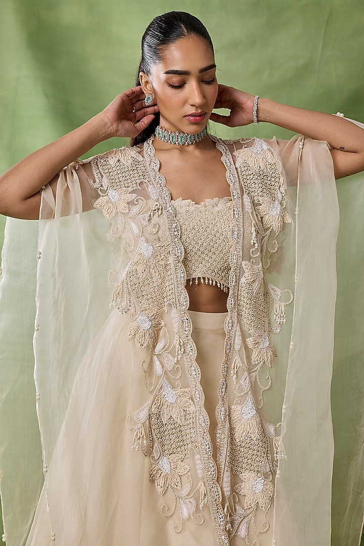 Ivory Organza Net Flared Skirt Set by AWIGNA BY VARSHA & RITTU at Pernia's Pop Up Shop