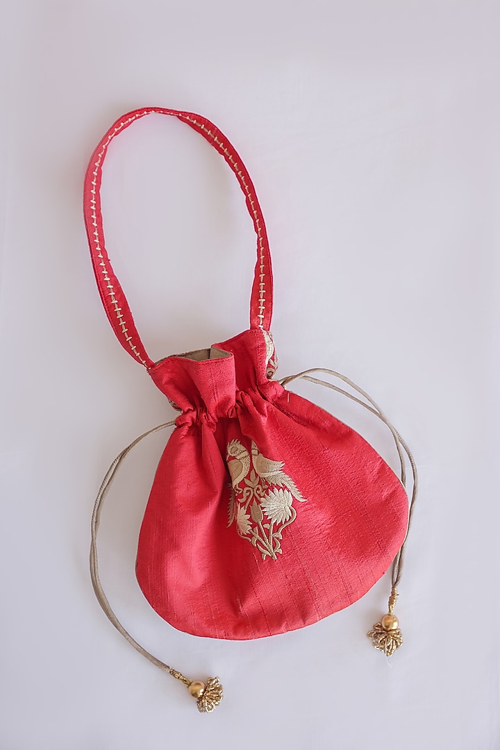 Red Raw Silk Hand Block Printed & Tassels Embroidered Potli Bag by ADYA Jaipur at Pernia's Pop Up Shop