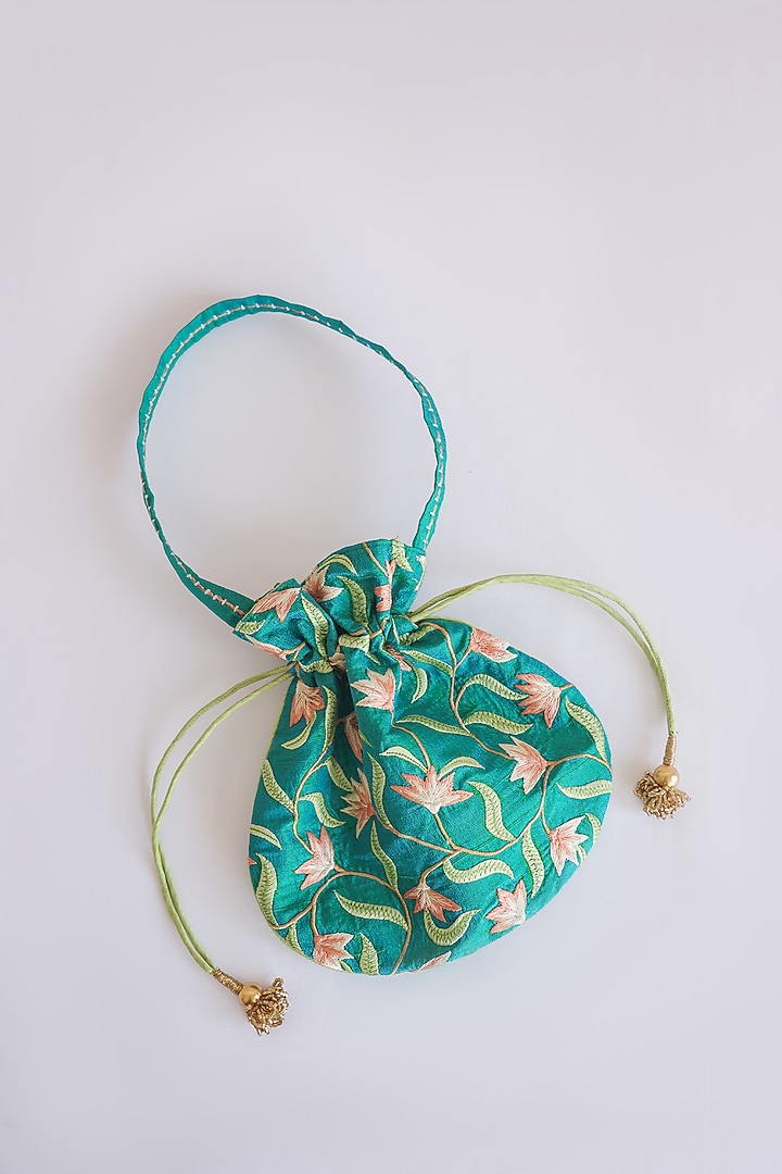 Green Raw Silk Floral Embroidered & Hand Block Printed Potli Bag by ADYA Jaipur at Pernia's Pop Up Shop